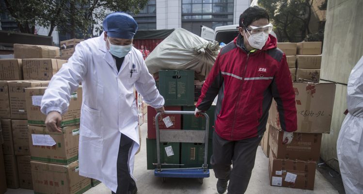 JD couriers our heroes in red delivering trust across the city of Wuhan 2 scaled 1 e1607323886659