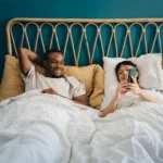 iphone couple on bed from huffpost